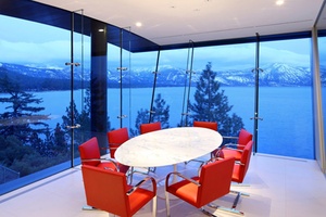 An office conference room overlooking a lake.