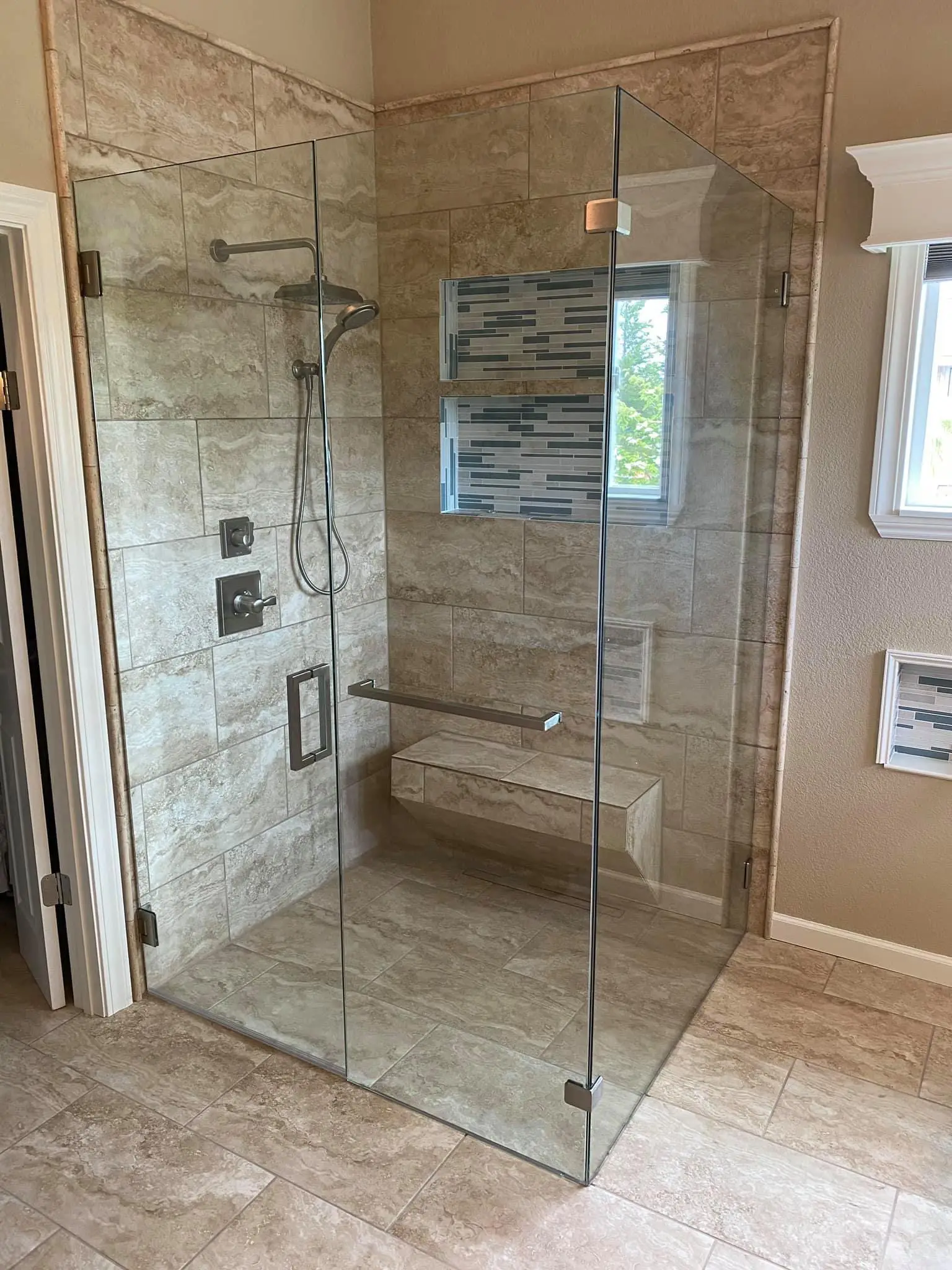 Clear square glass shower enclosure.